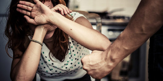 Woman Covering Her Face In Fear Of Domestic Violence